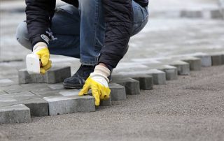 Install pavers over a concrete patio